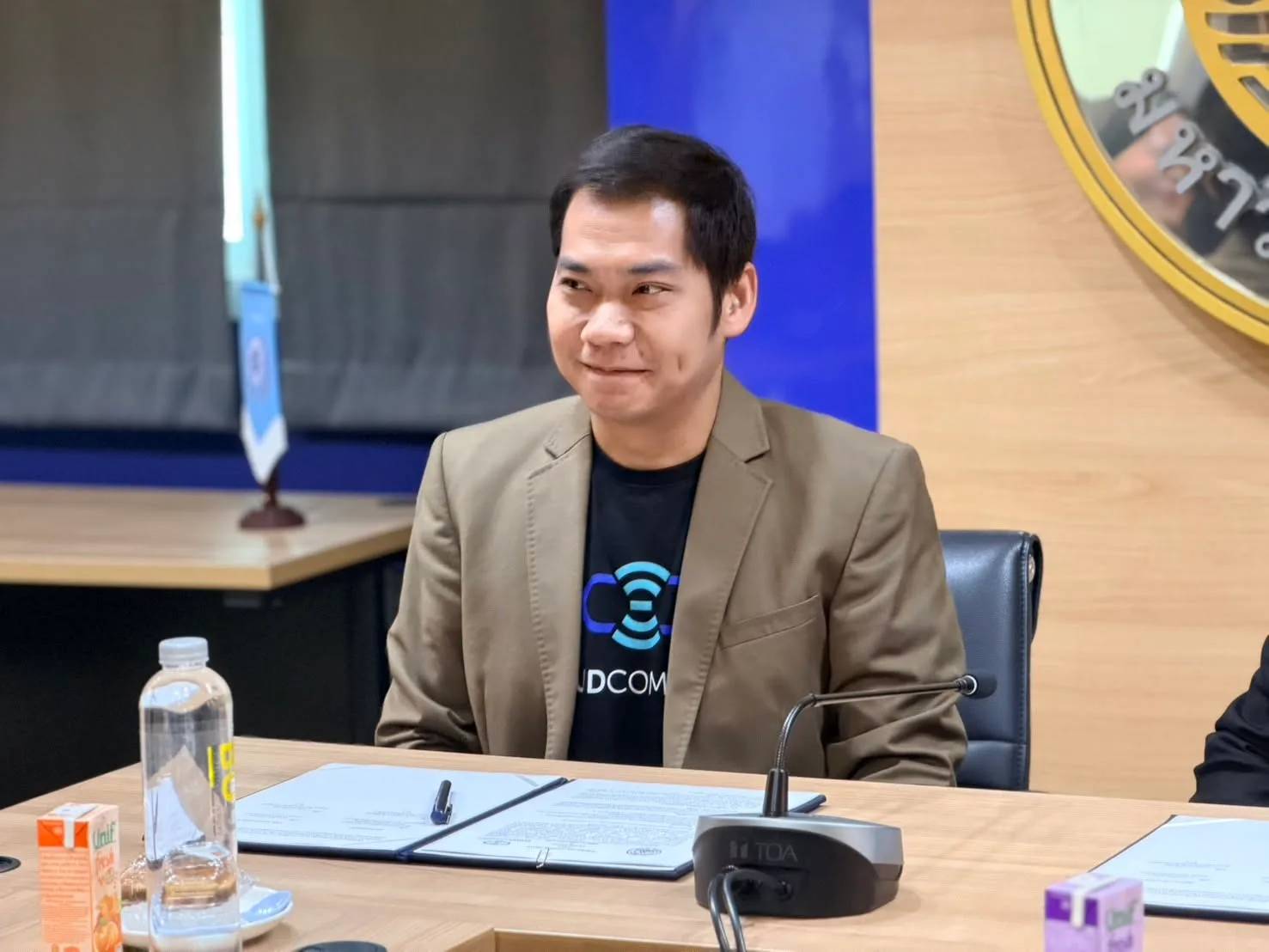 A CloudCommerce representative at the signing table