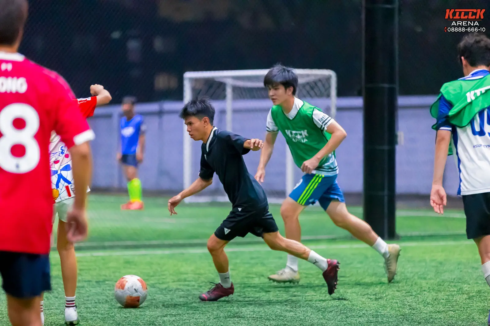 A defender challenges a forward