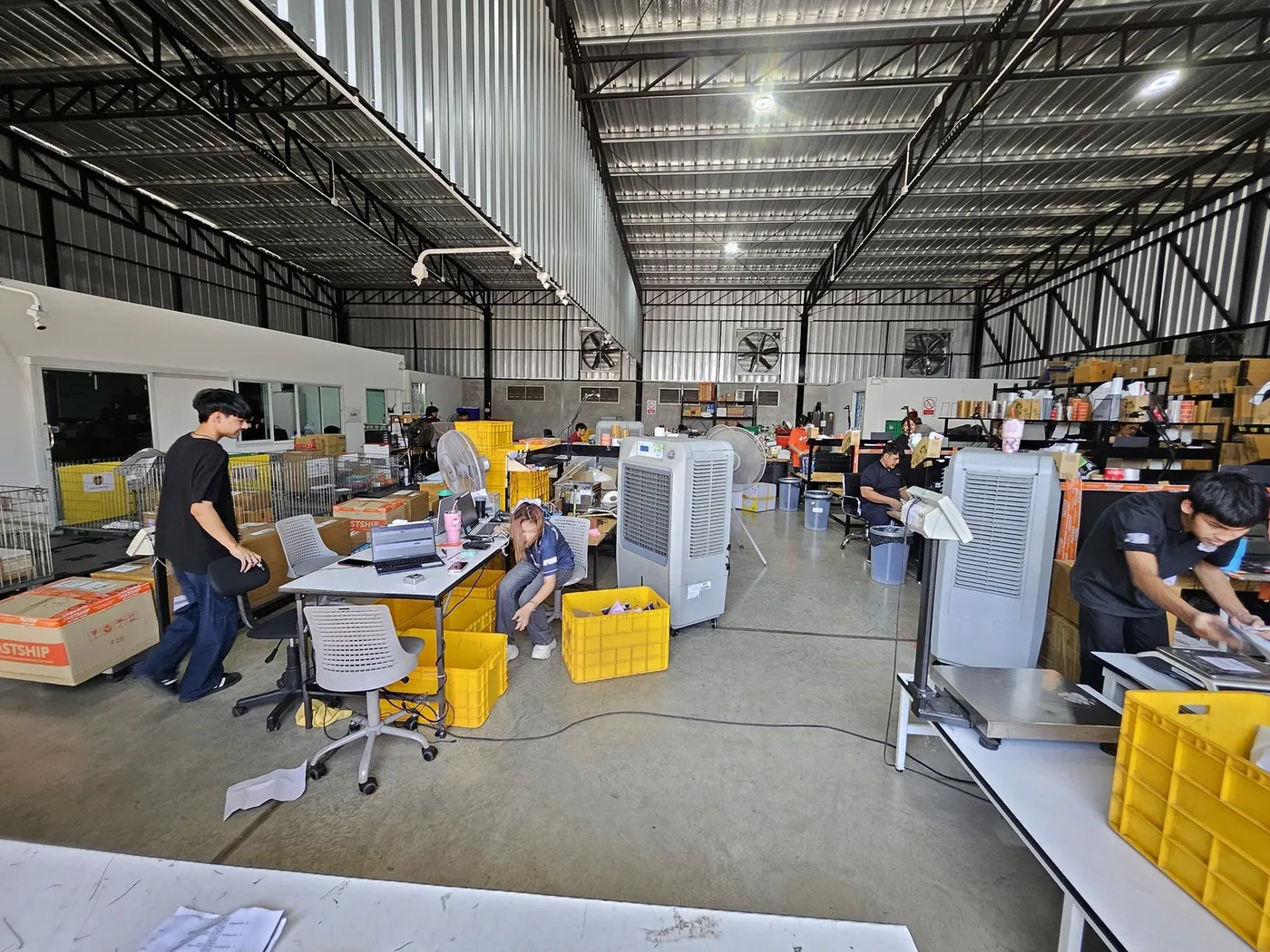 Parcels being weighed and packed in the fulfilment hub